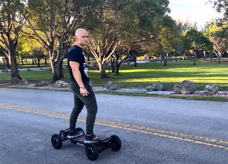 E board gliding on city streets