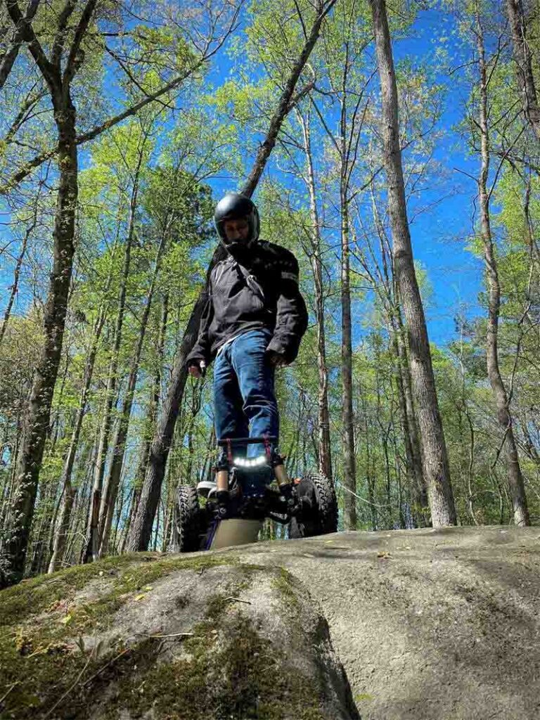 Riding electric skateboard longboard esk8 on Mountain Peaks