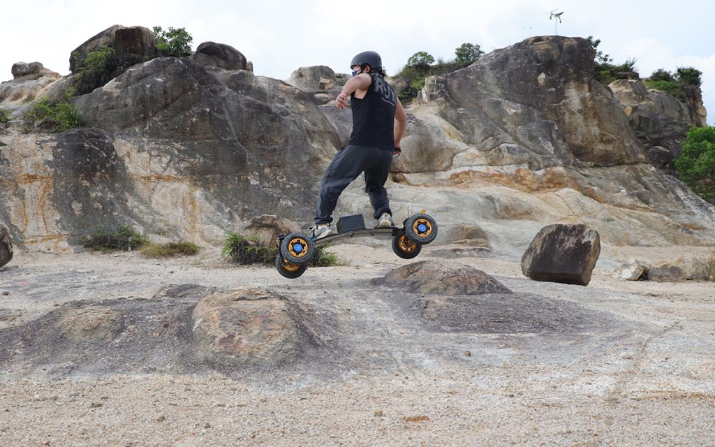 Man riding an electric mountain board
