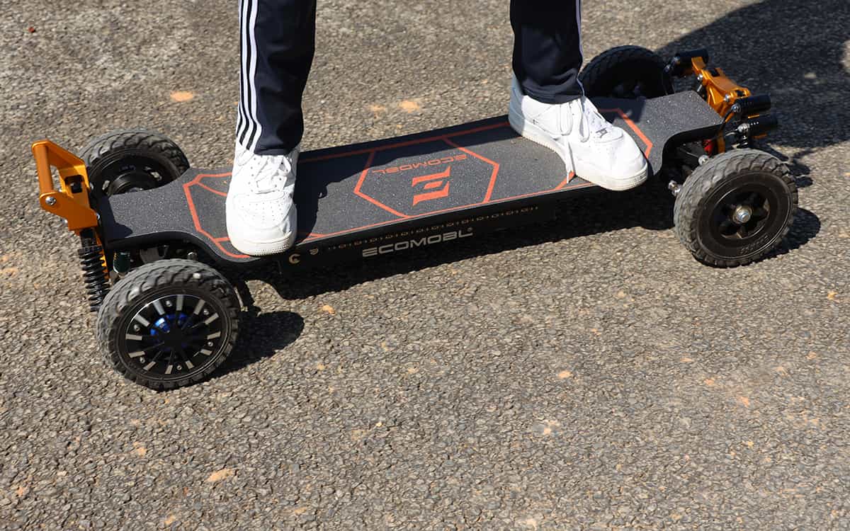 person standing on m24 2wd electric skateboard